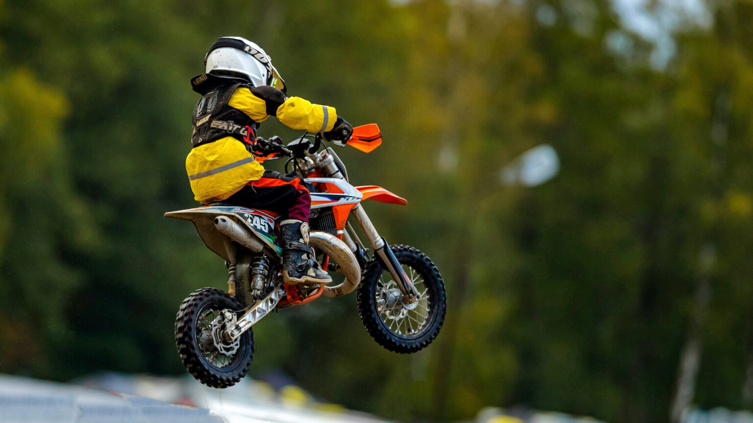 Young rider jumping a mini MX bike