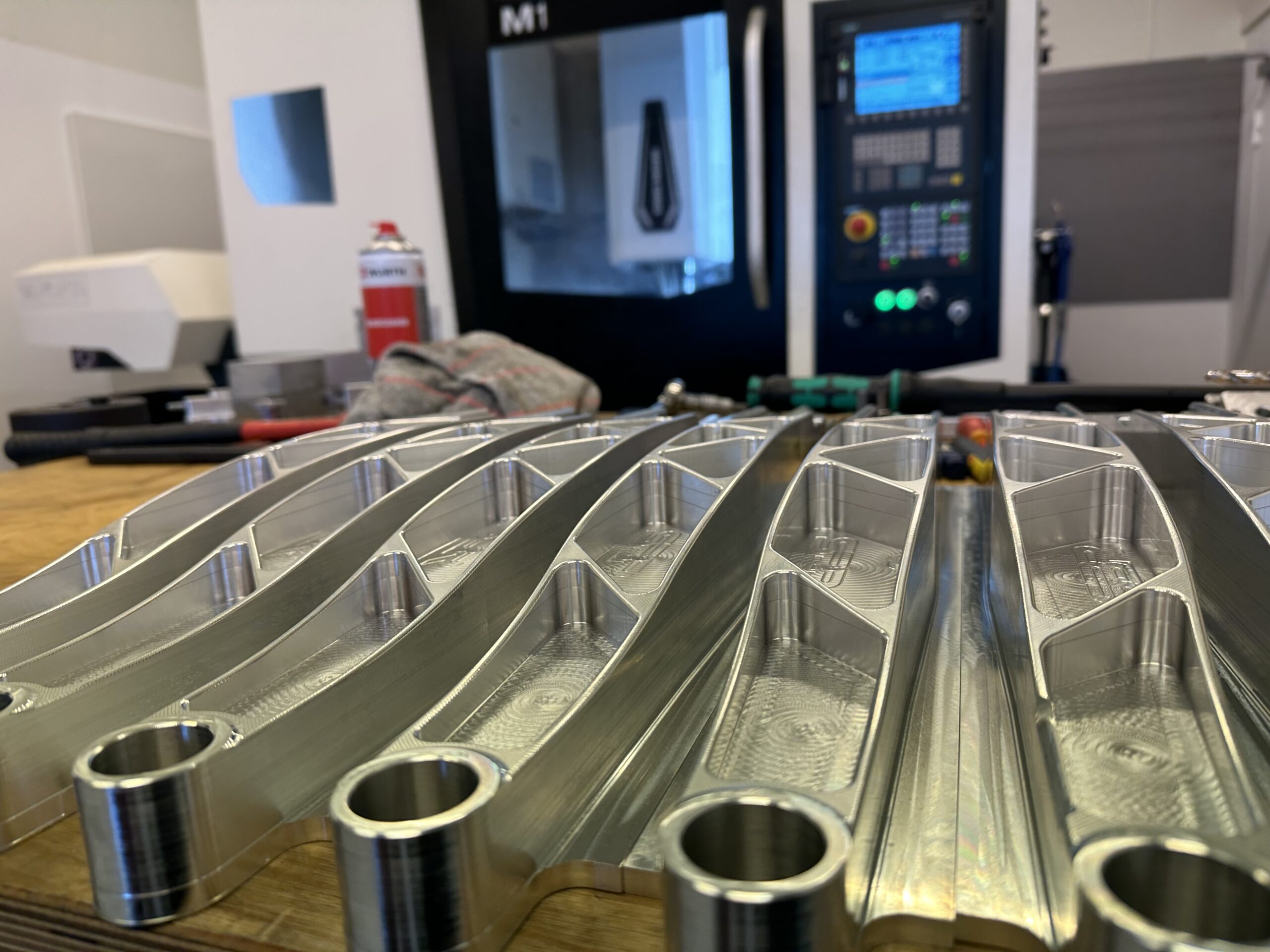 Machined aluminium swingarms in the SBR workshop